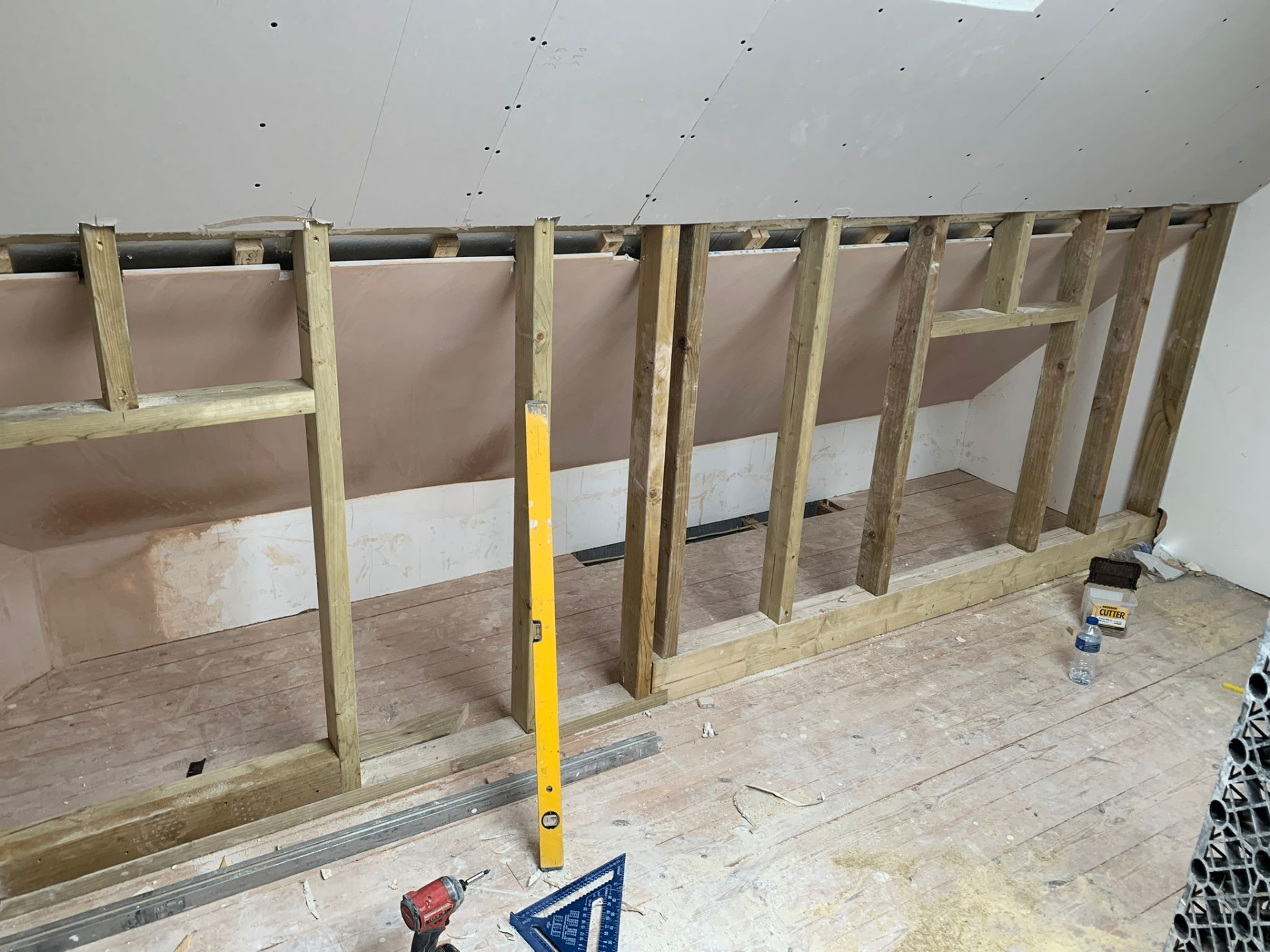 Eaves stud framing prepared for boarding and plasterboard in a Devon loft conversion by AJW Carpentry